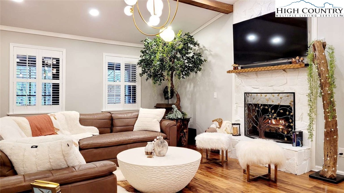 1157 Pine Ridge Road Beech Mountain, NC 28604 - Photo 2 of 25 a living room with furniture and a flat screen tv