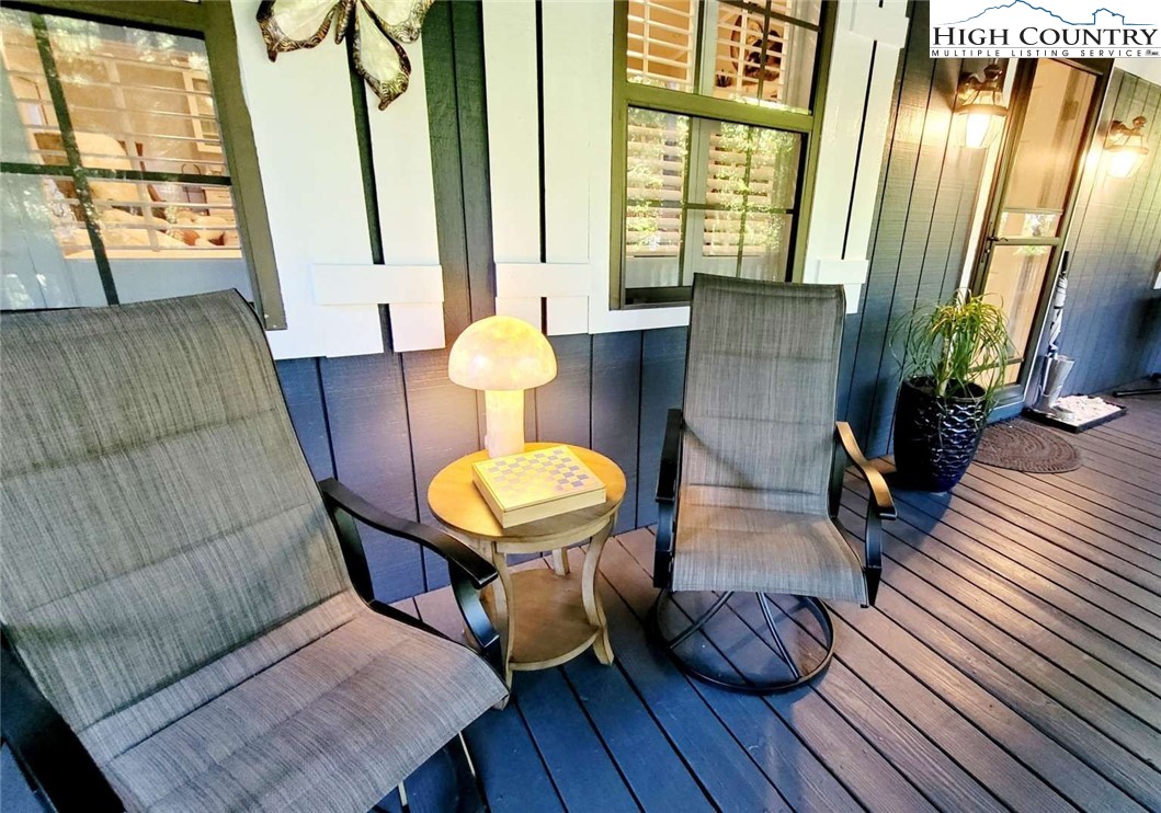 1157 Pine Ridge Road Beech Mountain, NC 28604 - Photo 22 of 25 a view of a livingroom with furniture wooden floor and a chandelier