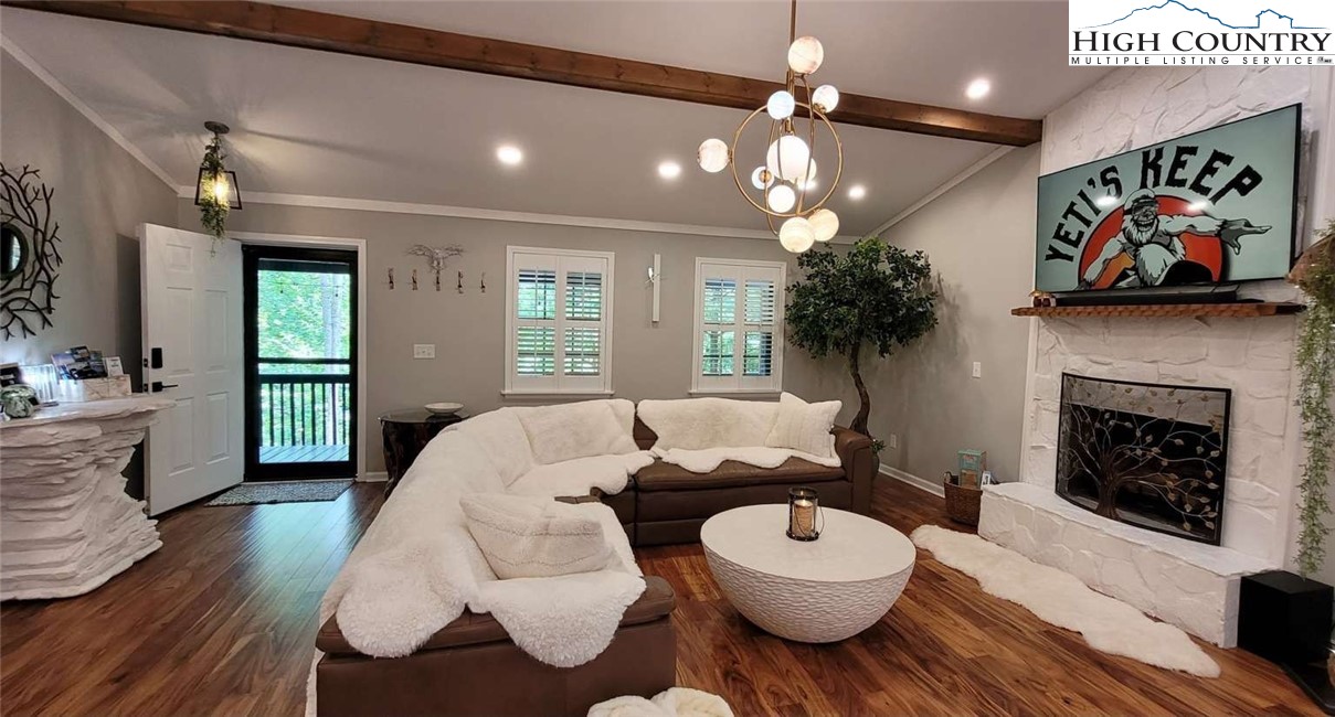1157 Pine Ridge Road Beech Mountain, NC 28604 - Photo 4 of 25 a living room with furniture and a fireplace