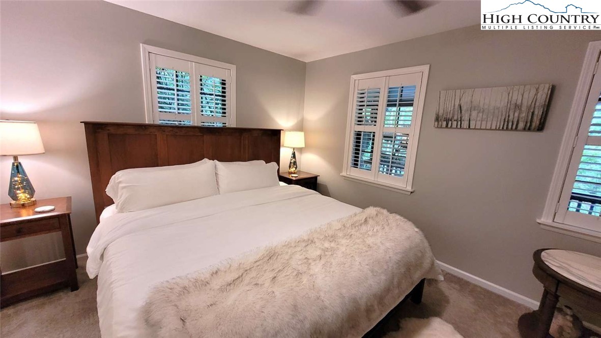 1157 Pine Ridge Road Beech Mountain, NC 28604 - Photo 9 of 25 a bedroom with a bed and a window