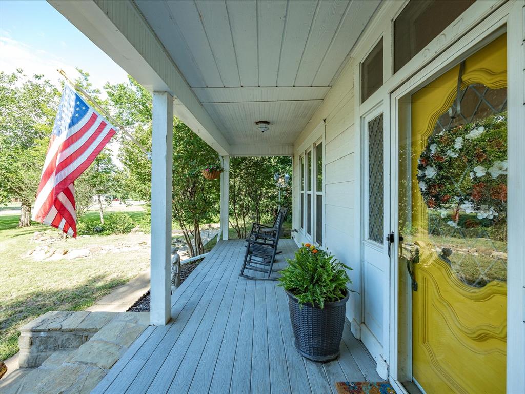 907 4th Street Graham, TX 76450 - Photo 4 of 34 a view of a porch with furniture and garden