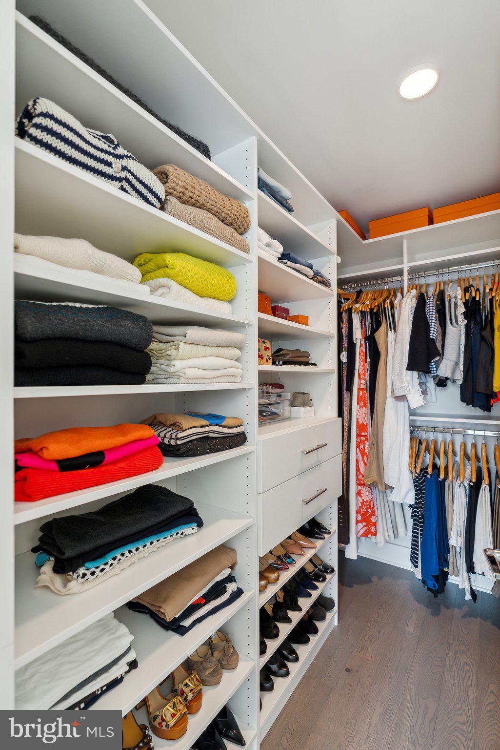 4960 Fairmont Avenue, Unit 706 Bethesda, MD 20814 - Photo 11 of 26 a view of walk in closet with clothes and shoes