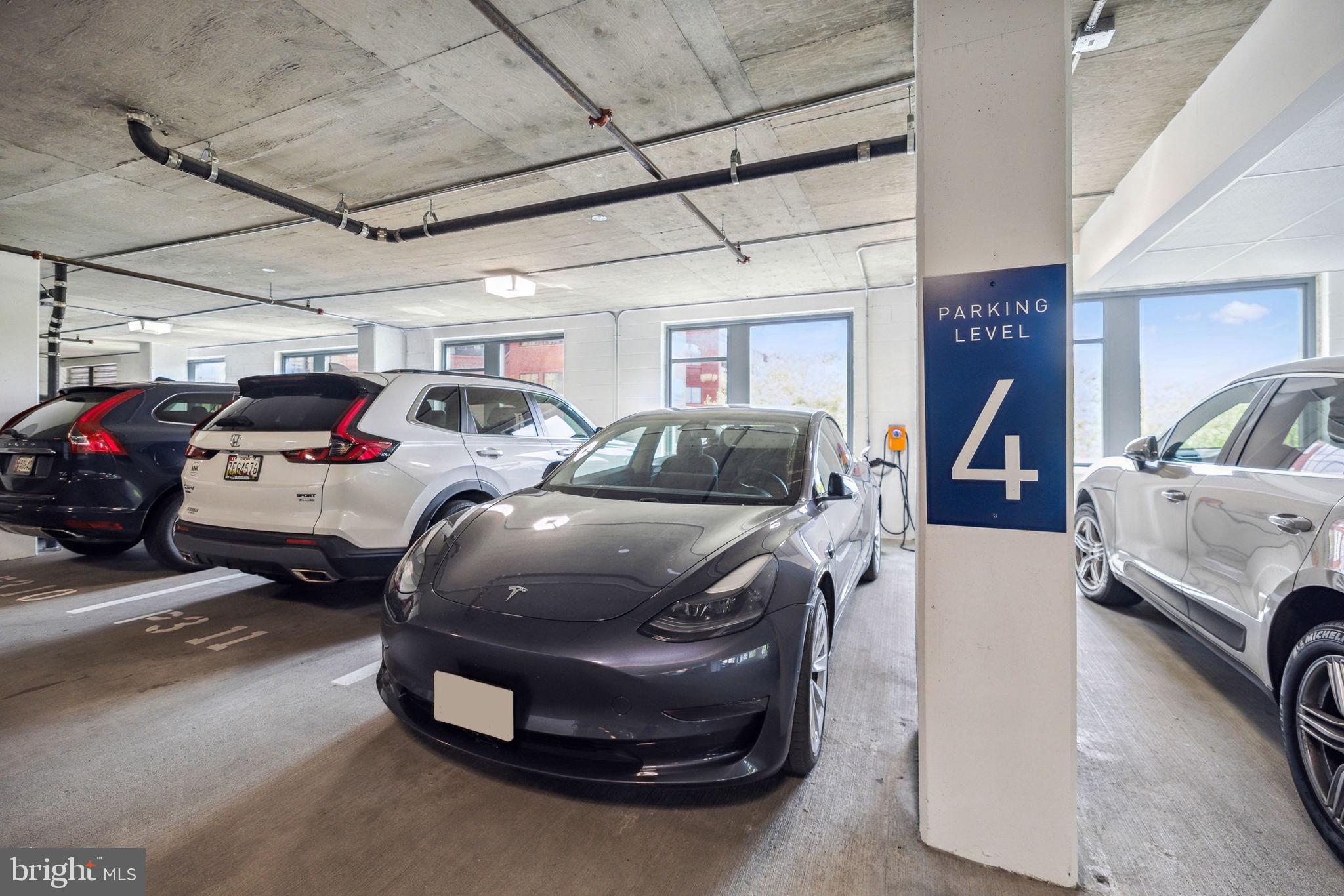 4960 Fairmont Avenue, Unit 706 Bethesda, MD 20814 - Photo 22 of 26 a view of cars parked in a parking