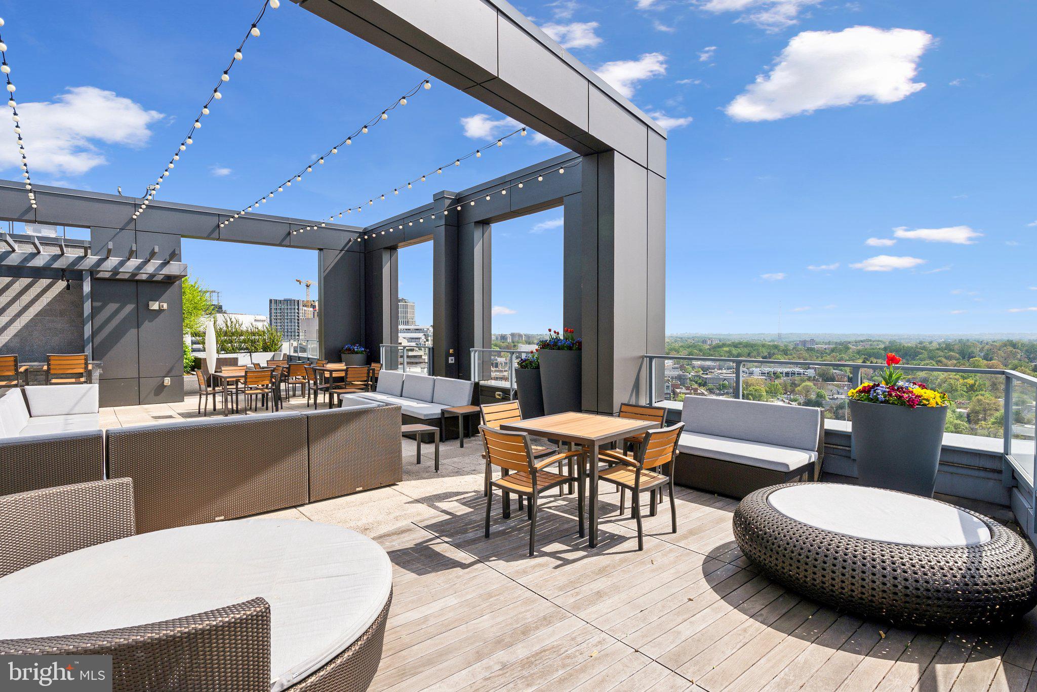 4960 Fairmont Avenue, Unit 706 Bethesda, MD 20814 - Photo 25 of 26 a living room with furniture and a large window