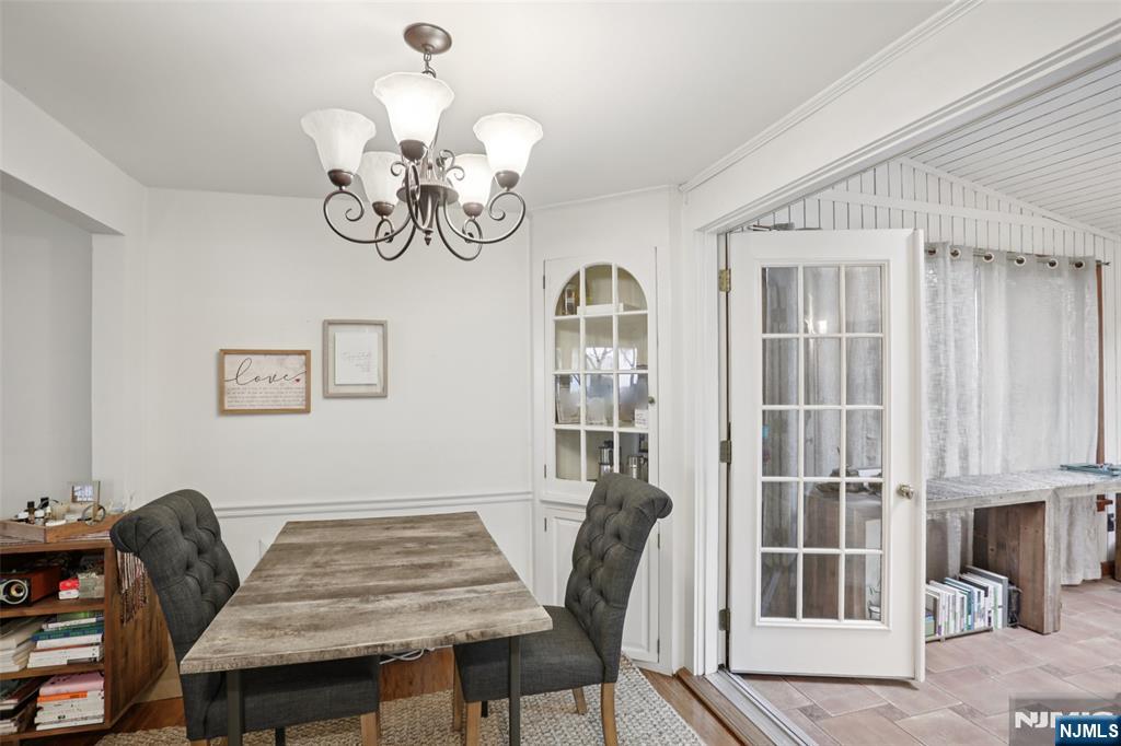 322 Marshall Street Ridgewood, NJ 07450 - Photo 11 of 32 a view of a dining room with furniture chandelier and wooden floor