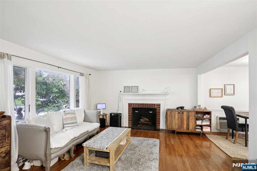 322 Marshall Street Ridgewood, NJ 07450 - Photo 8 of 32 a living room with furniture and a fireplace