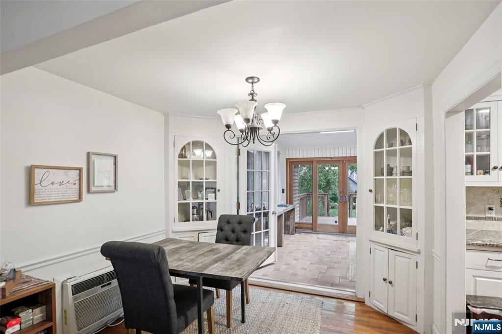 322 Marshall Street Ridgewood, NJ 07450 - Photo 10 of 32 a view of a dining room with furniture a chandelier and wooden floor