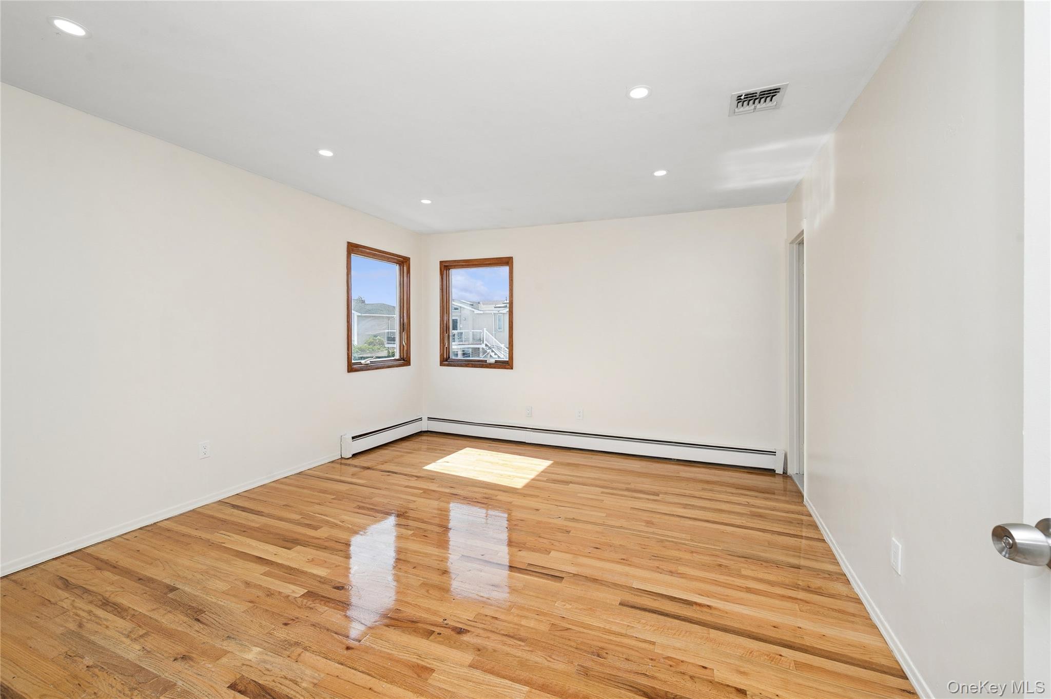 2625 Riverside Drive Wantagh, NY 11793 - Photo 16 of 20 a view of empty room with wooden floor