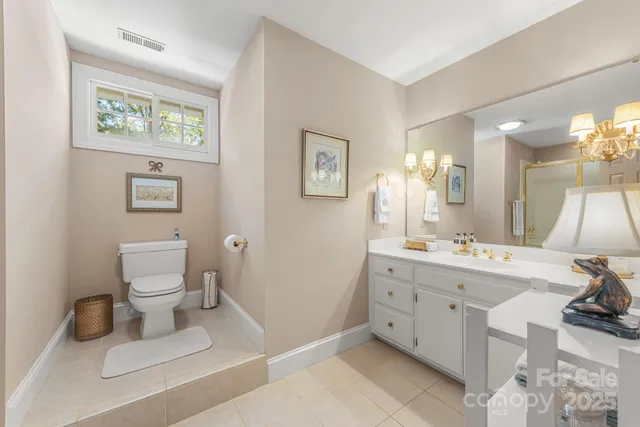 a bathroom with a tub shower and sink