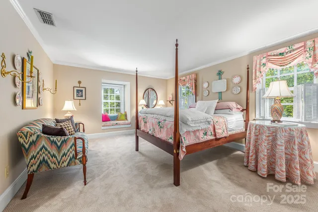 a bedroom with furniture and a window