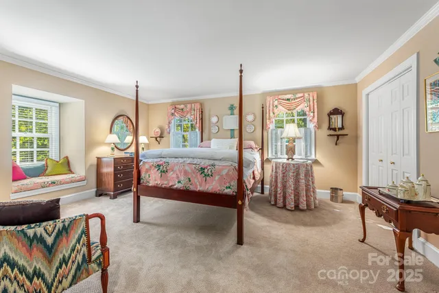 a living room with furniture and stairs