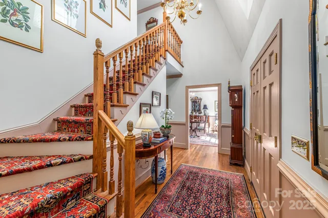 a view of an entryway with wooden floor