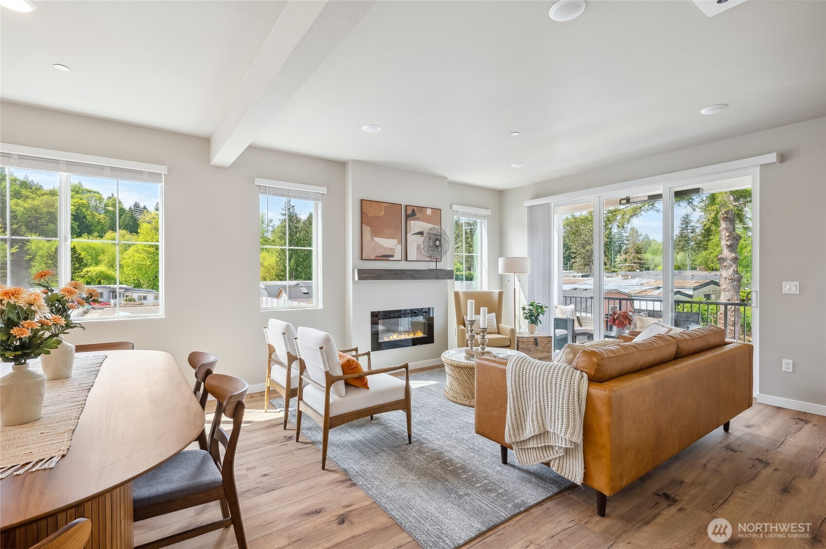 1322 194th Street Southeast, Unit D2 Bothell, WA 98012 - Photo 4 of 18 a living room with fireplace furniture and a large window