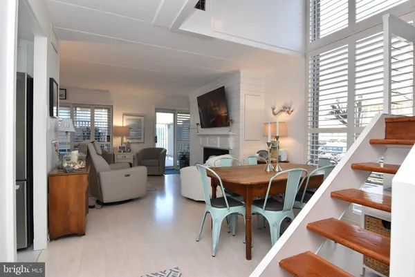 a dining room with furniture and entryway