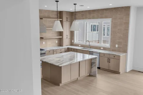 a kitchen with a stove and a sink