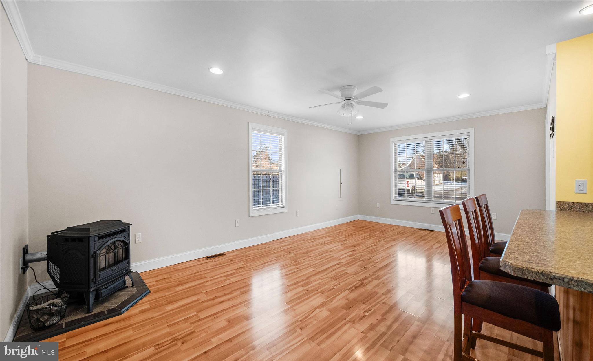 31536 White Street Laurel, DE 19956 - Photo 12 of 62 a view of a room with furniture a ceiling fan and wooden floor