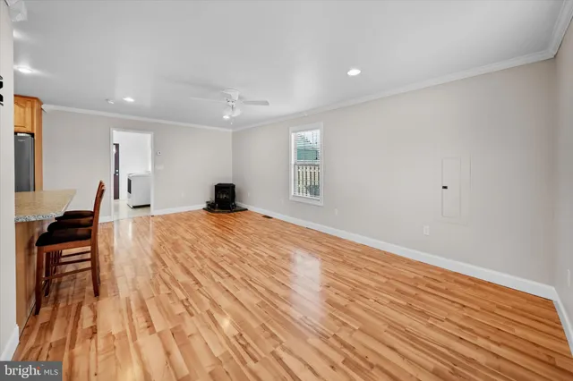 a view of dining room with furniture and wooden floor