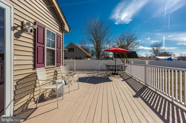 a view of a patio with wooden floor