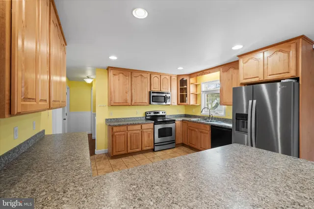 a kitchen with a stove and a microwave