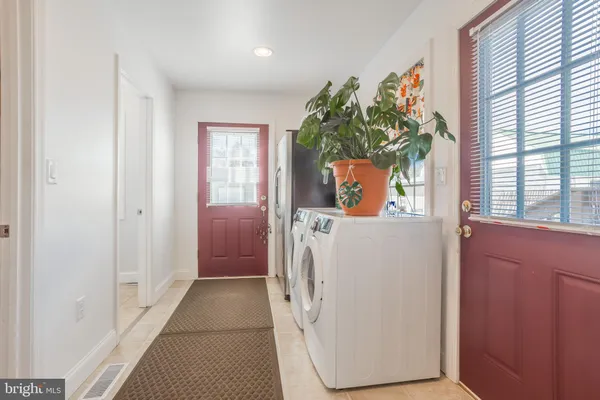 a bathroom with a toilet a sink and a window