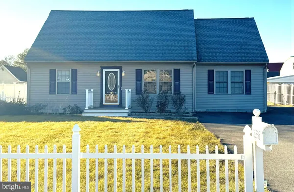 a front view of a house with a swimming pool