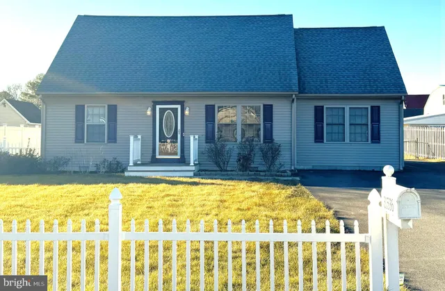 a front view of a house with a swimming pool