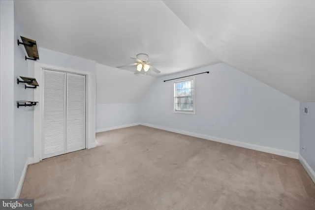 a view of a house with snow in front of it