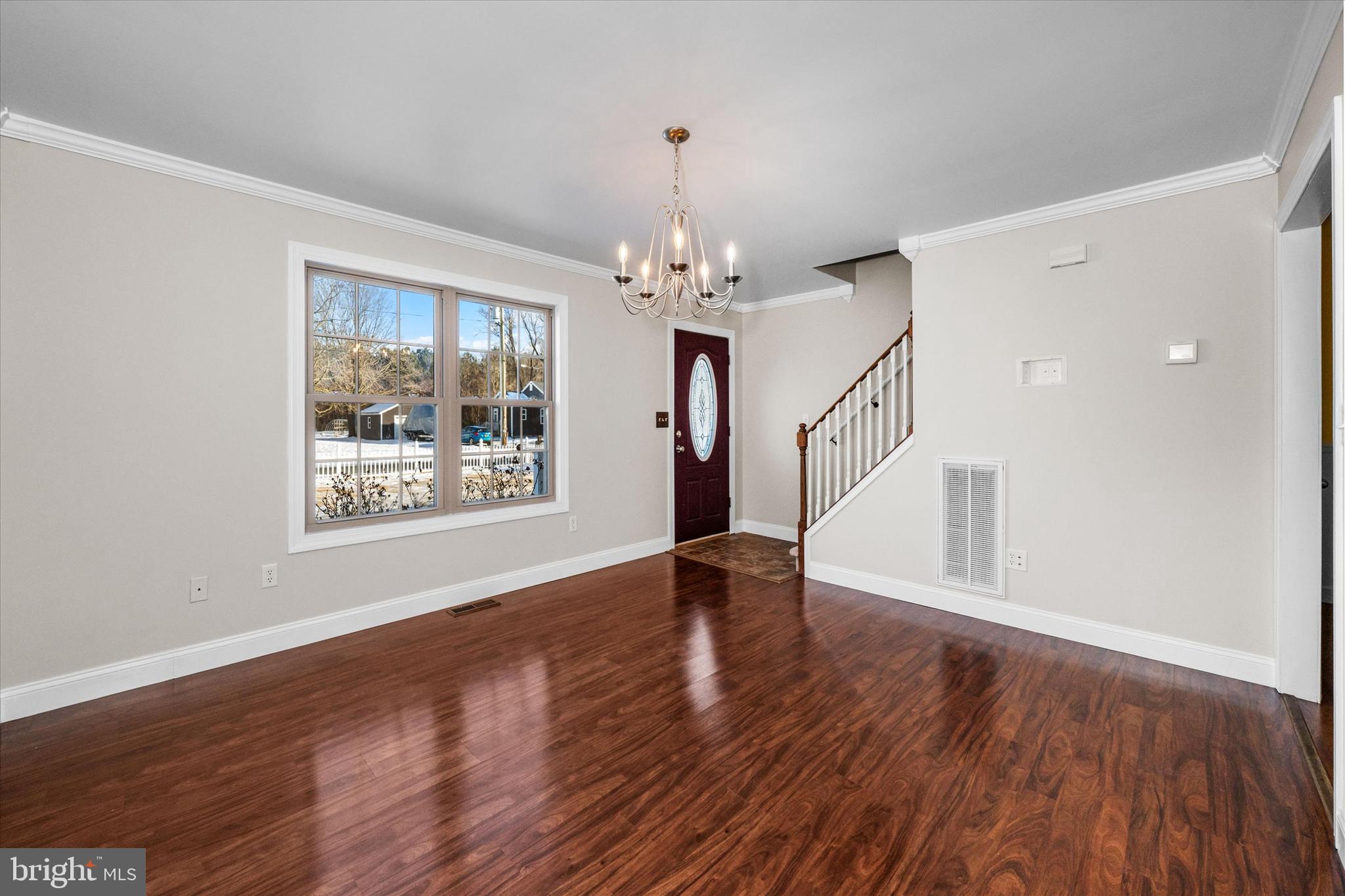 31536 White Street Laurel, DE 19956 - Photo 8 of 62 a view of an empty room with wooden floor and a window
