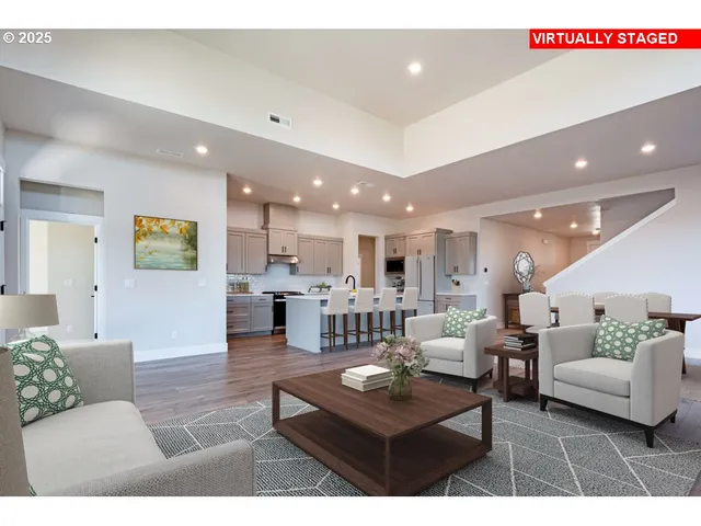 a living room with furniture and kitchen view