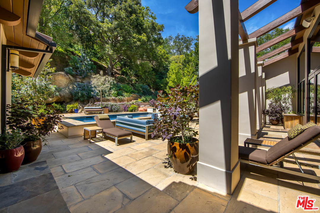 1787 Old Ranch Road Los Angeles, CA 90049 - Photo 13 of 54 a bench sitting in front of a building