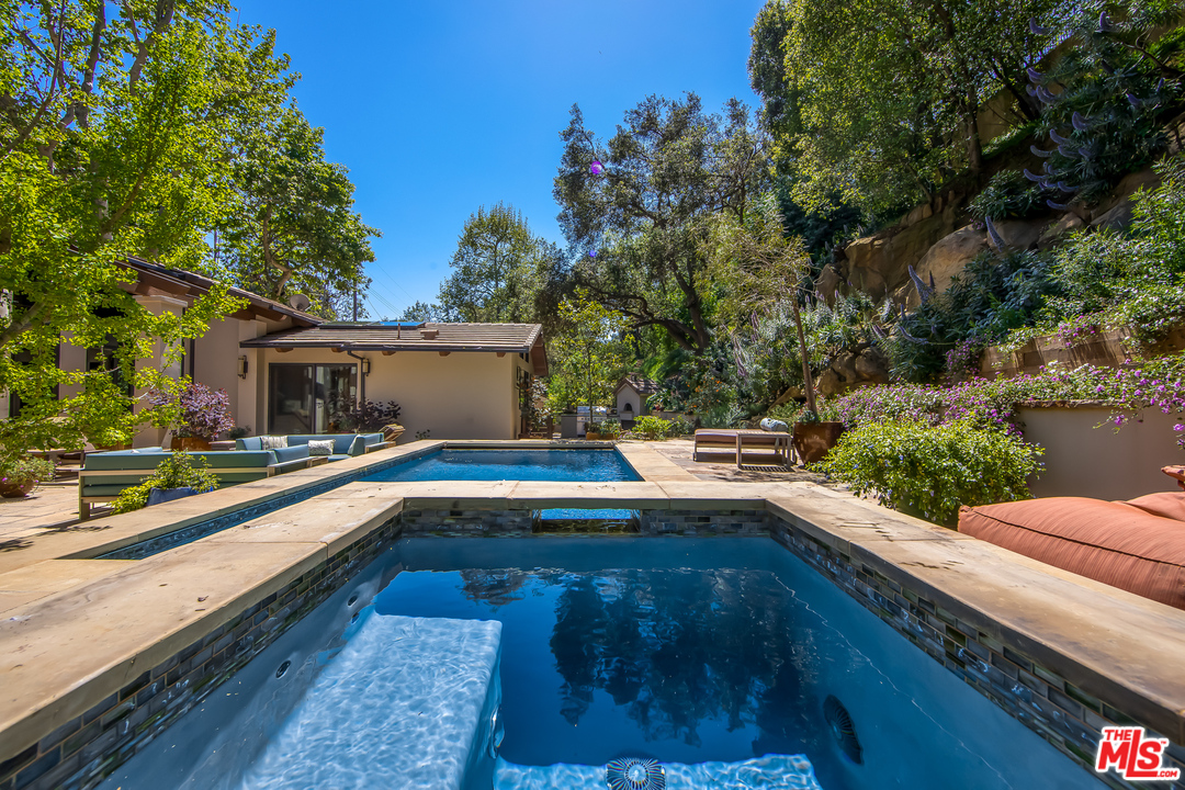 1787 Old Ranch Road Los Angeles, CA 90049 - Photo 14 of 54 a view of house with swimming pool