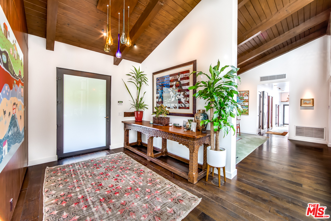 1787 Old Ranch Road Los Angeles, CA 90049 - Photo 15 of 54 a view of an entryway with wooden floor