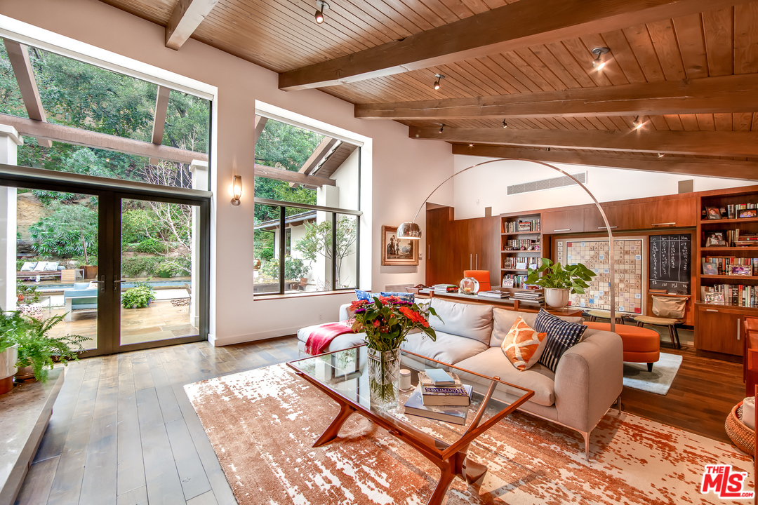 1787 Old Ranch Road Los Angeles, CA 90049 - Photo 19 of 54 a living room with furniture and a wooden floor