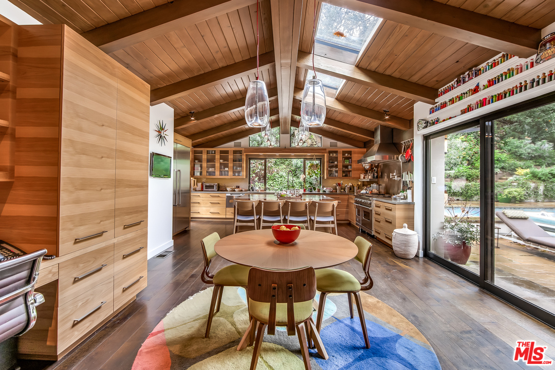 1787 Old Ranch Road Los Angeles, CA 90049 - Photo 24 of 54 a dining room with furniture and wooden floor