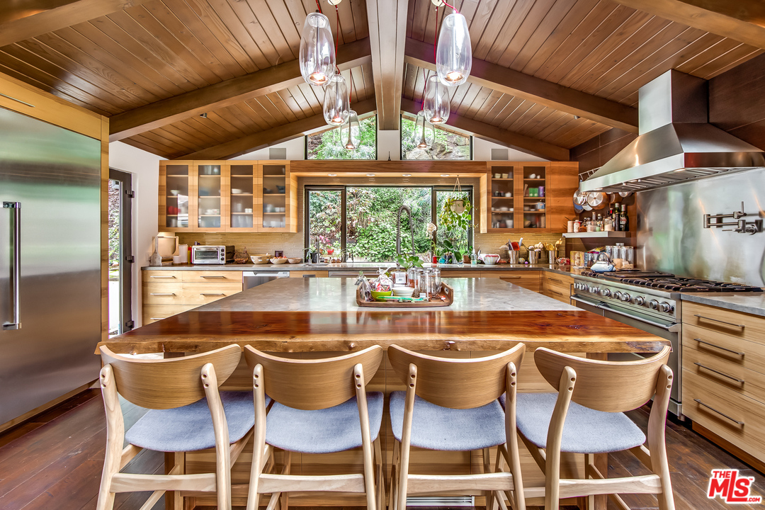 1787 Old Ranch Road Los Angeles, CA 90049 - Photo 26 of 54 a outdoor dining space with swimming pool and furniture