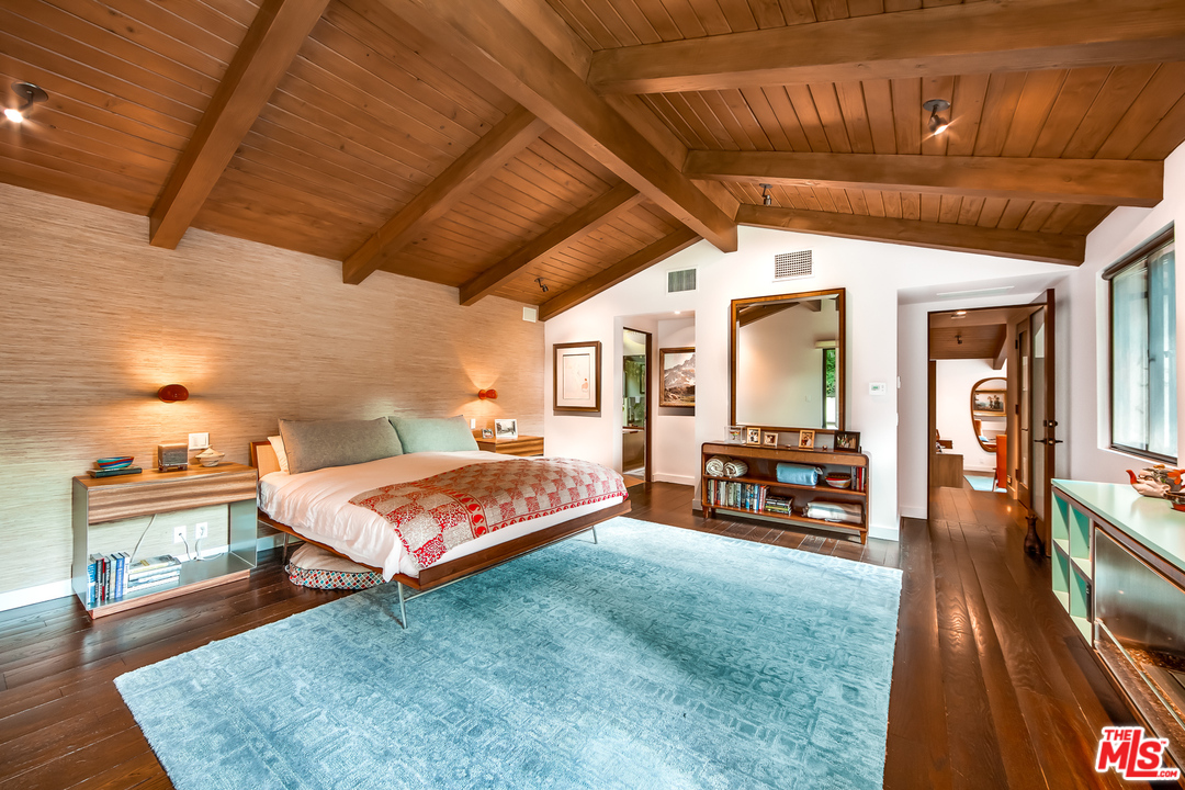 1787 Old Ranch Road Los Angeles, CA 90049 - Photo 29 of 54 a spacious bedroom with a bed and a view of bedroom