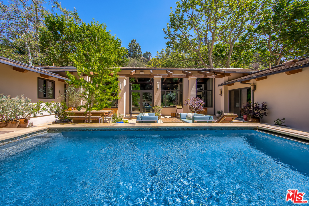 1787 Old Ranch Road Los Angeles, CA 90049 - Photo 4 of 54 a view of swimming pool with lawn chairs and plants