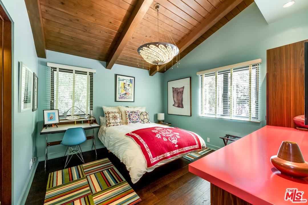 1787 Old Ranch Road Los Angeles, CA 90049 - Photo 38 of 54 a bedroom with a bed and windows