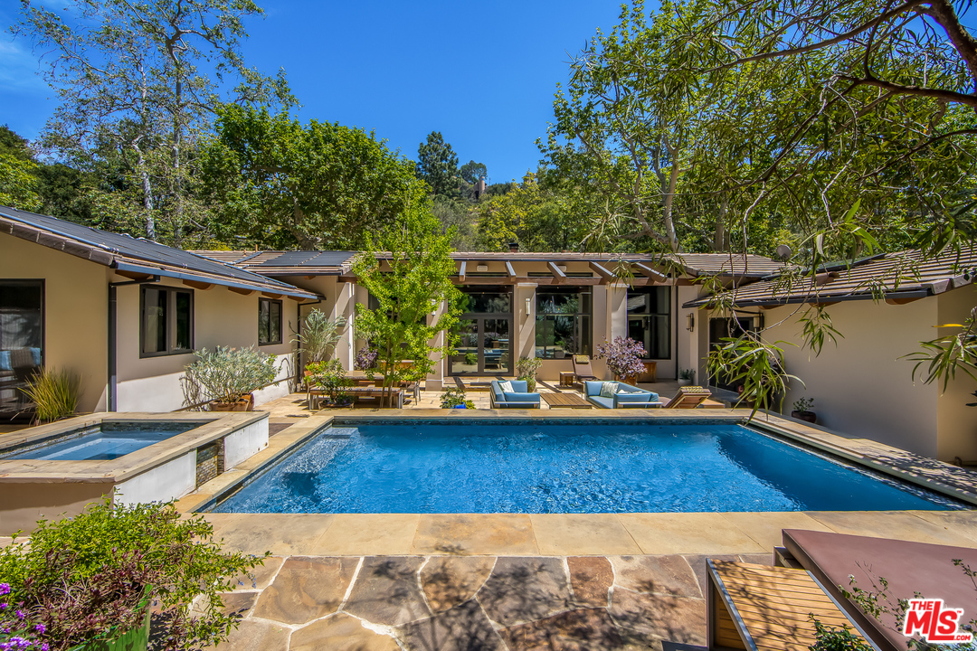 1787 Old Ranch Road Los Angeles, CA 90049 - Photo 48 of 54 a view of a house with swimming pool and sitting area