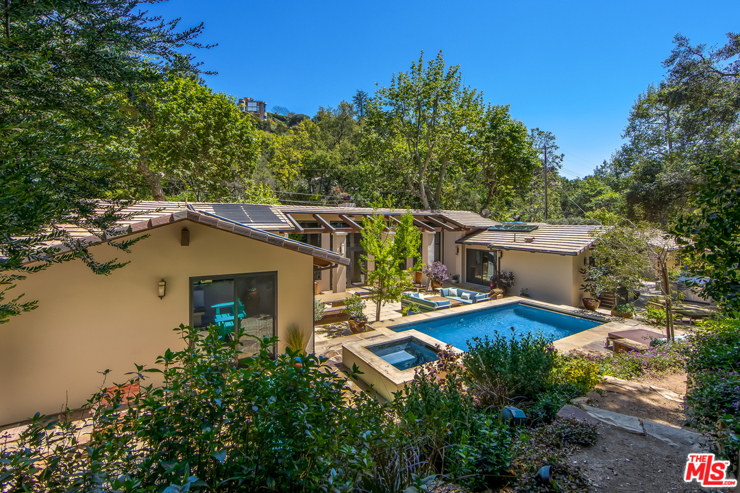 1787 Old Ranch Road Los Angeles, CA 90049 - Photo 50 of 54 a view of a house with pool yard and outdoor seating