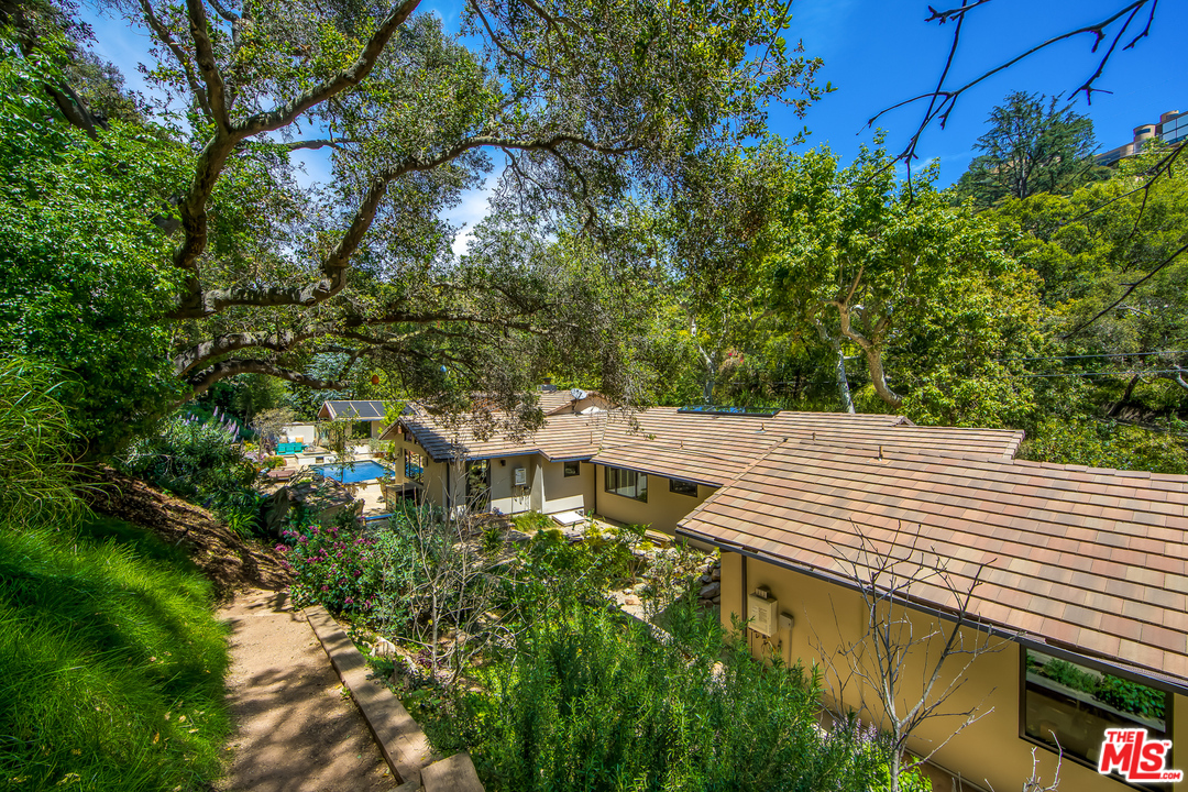 1787 Old Ranch Road Los Angeles, CA 90049 - Photo 51 of 54 a view of a house with a tree