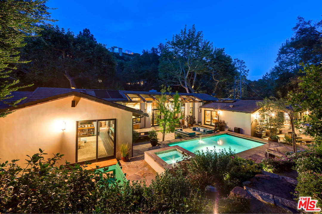 1787 Old Ranch Road Los Angeles, CA 90049 - Photo 52 of 54 a view of a swimming pool with an outdoor space and seating area