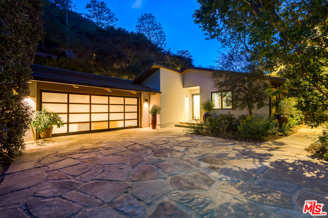 1787 Old Ranch Road Los Angeles, CA 90049 - Photo 54 of 54 a view of a house with a yard