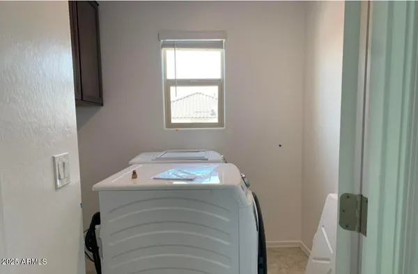 a room with a bed and a window