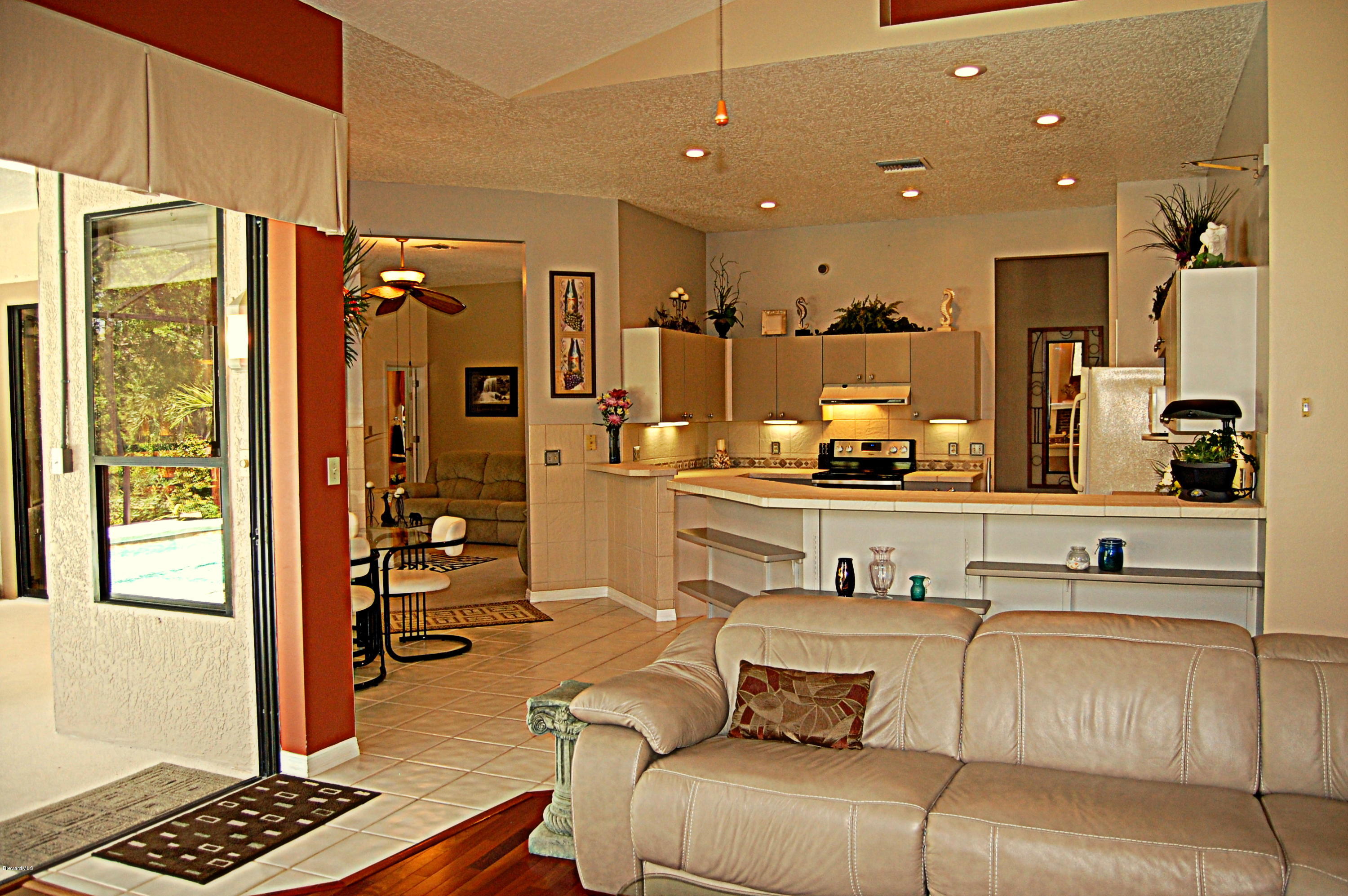 3880 Shady Run Road Melbourne, FL 32934 - Photo 11 of 41 Fam Room open to Kitchen
