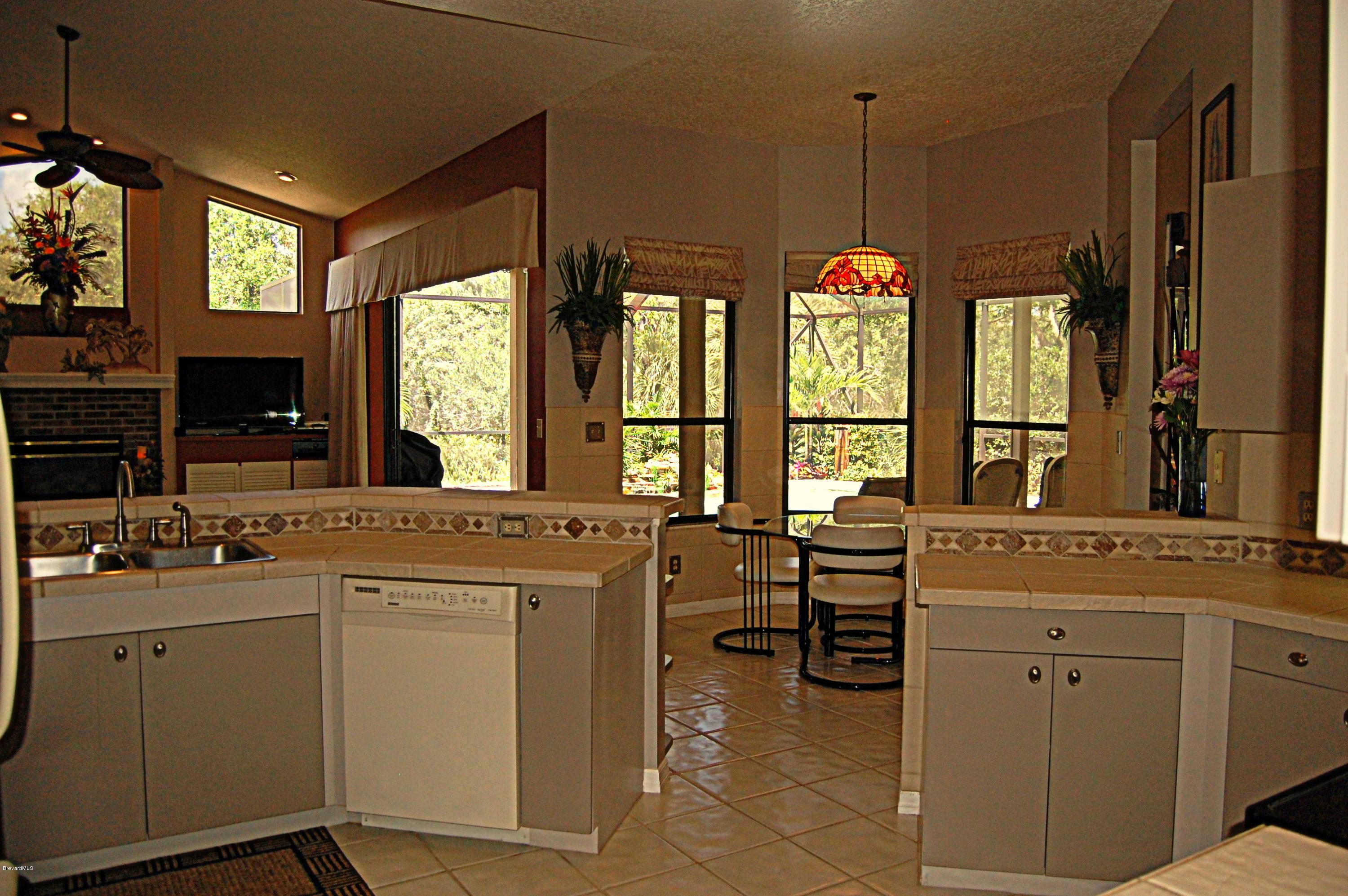 3880 Shady Run Road Melbourne, FL 32934 - Photo 13 of 41 Pool Views from Kitchen
