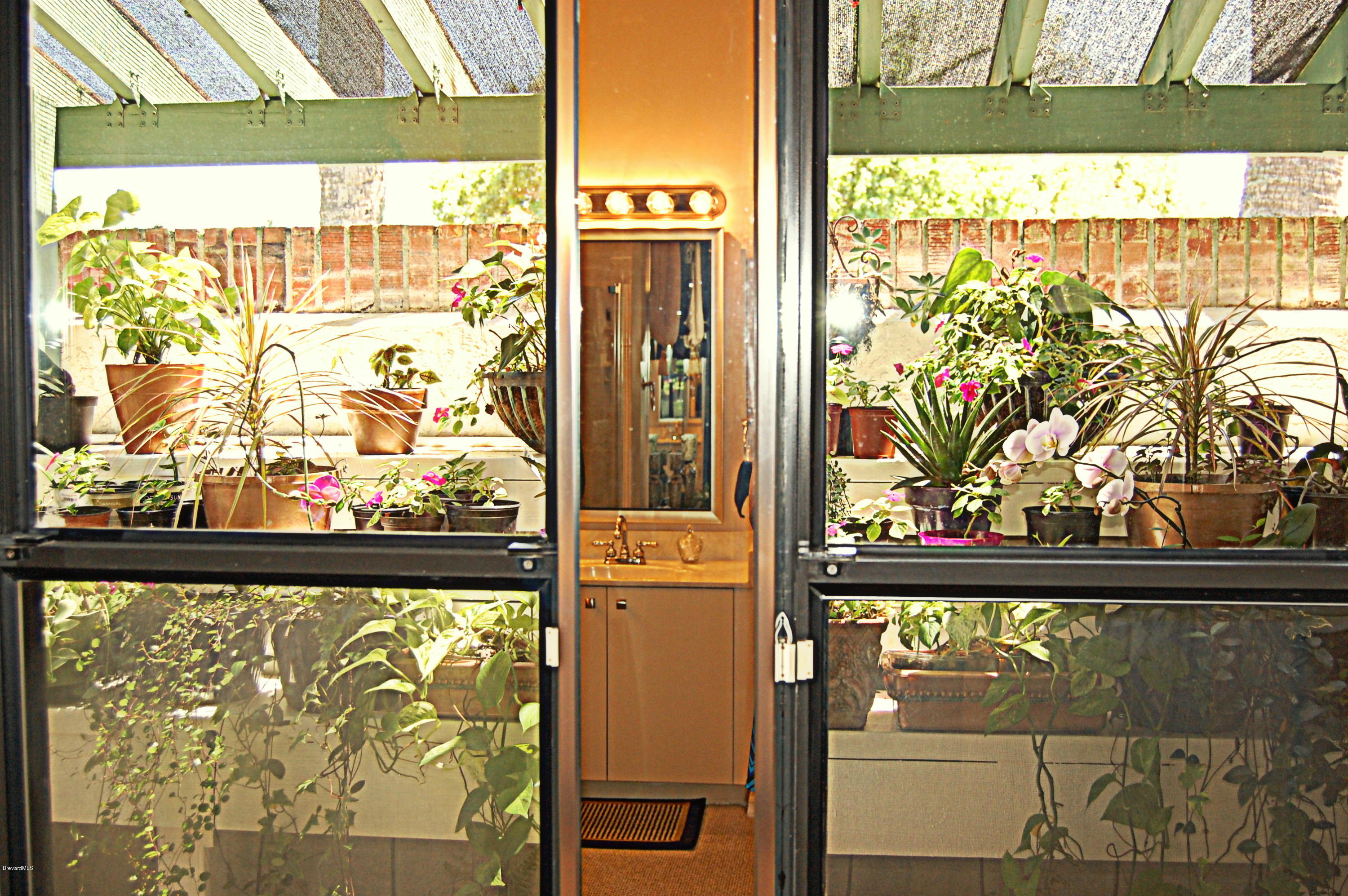 3880 Shady Run Road Melbourne, FL 32934 - Photo 22 of 41 Very Unique! Atrium/Orchid Room