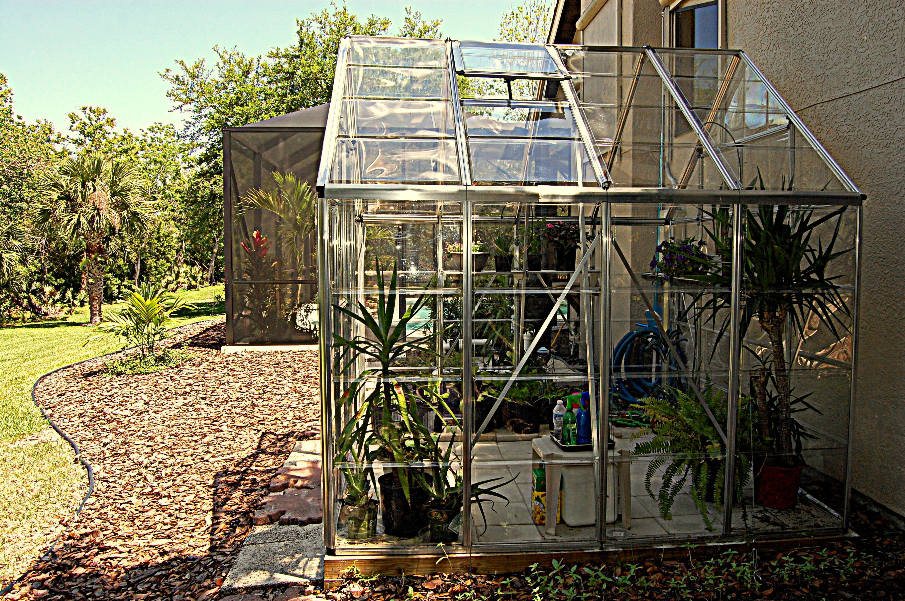 3880 Shady Run Road Melbourne, FL 32934 - Photo 33 of 41 Side View of Greenhouse