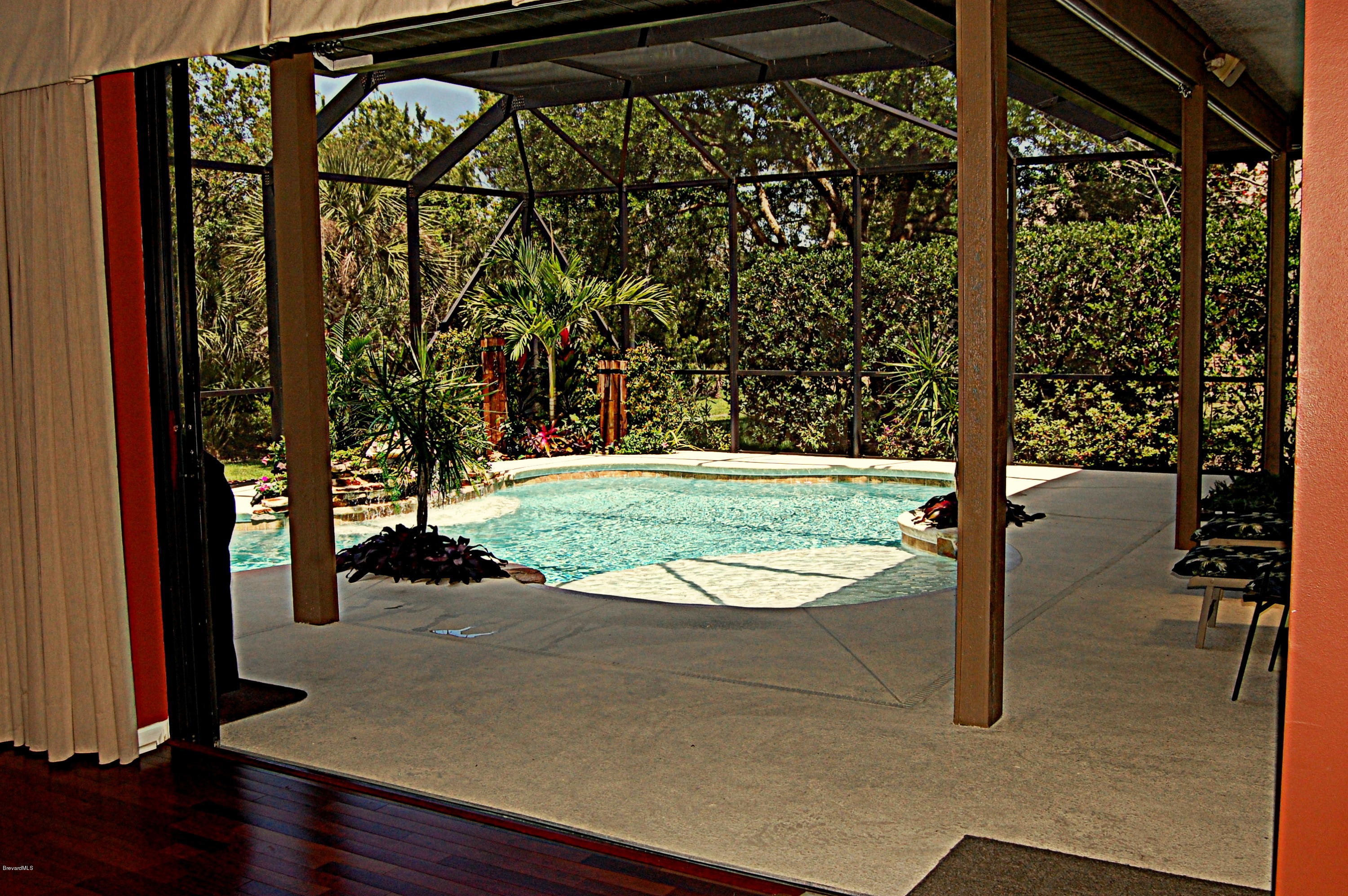 3880 Shady Run Road Melbourne, FL 32934 - Photo 5 of 41 Fam Room slider pocket doors bring the