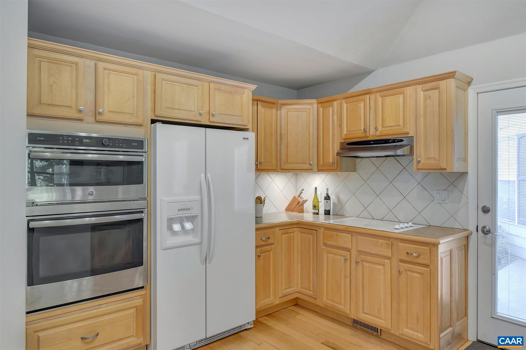 292 Blackthorn Lane Charlottesville, VA 22902 - Photo 17 of 64 a kitchen with stainless steel appliances white cabinets and a refrigerator